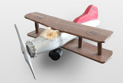 O.T. (Flugzeug) Holzplastik, farbig gefasst, Kunststoff, Metall